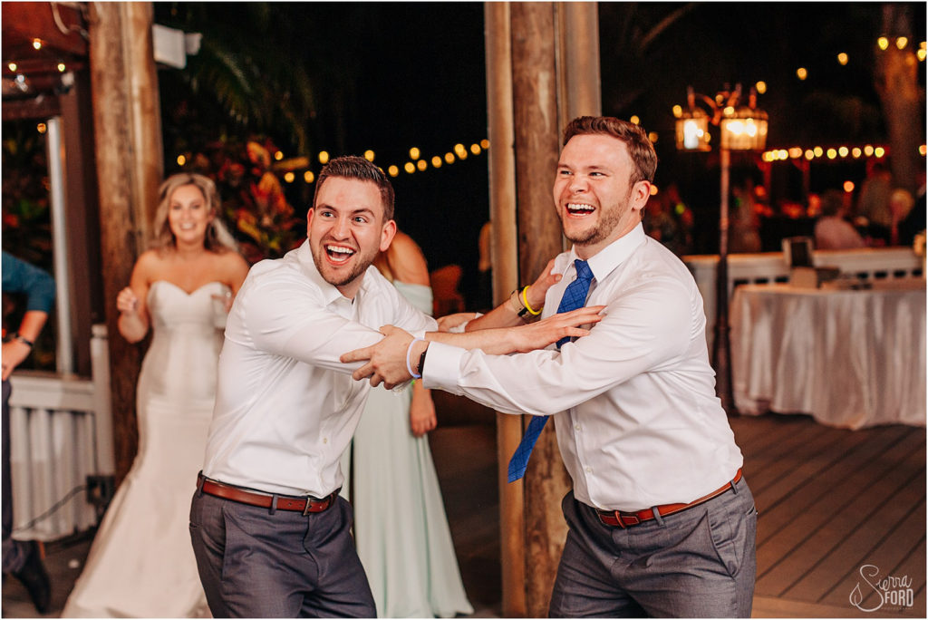 men dancing at a wedding reception