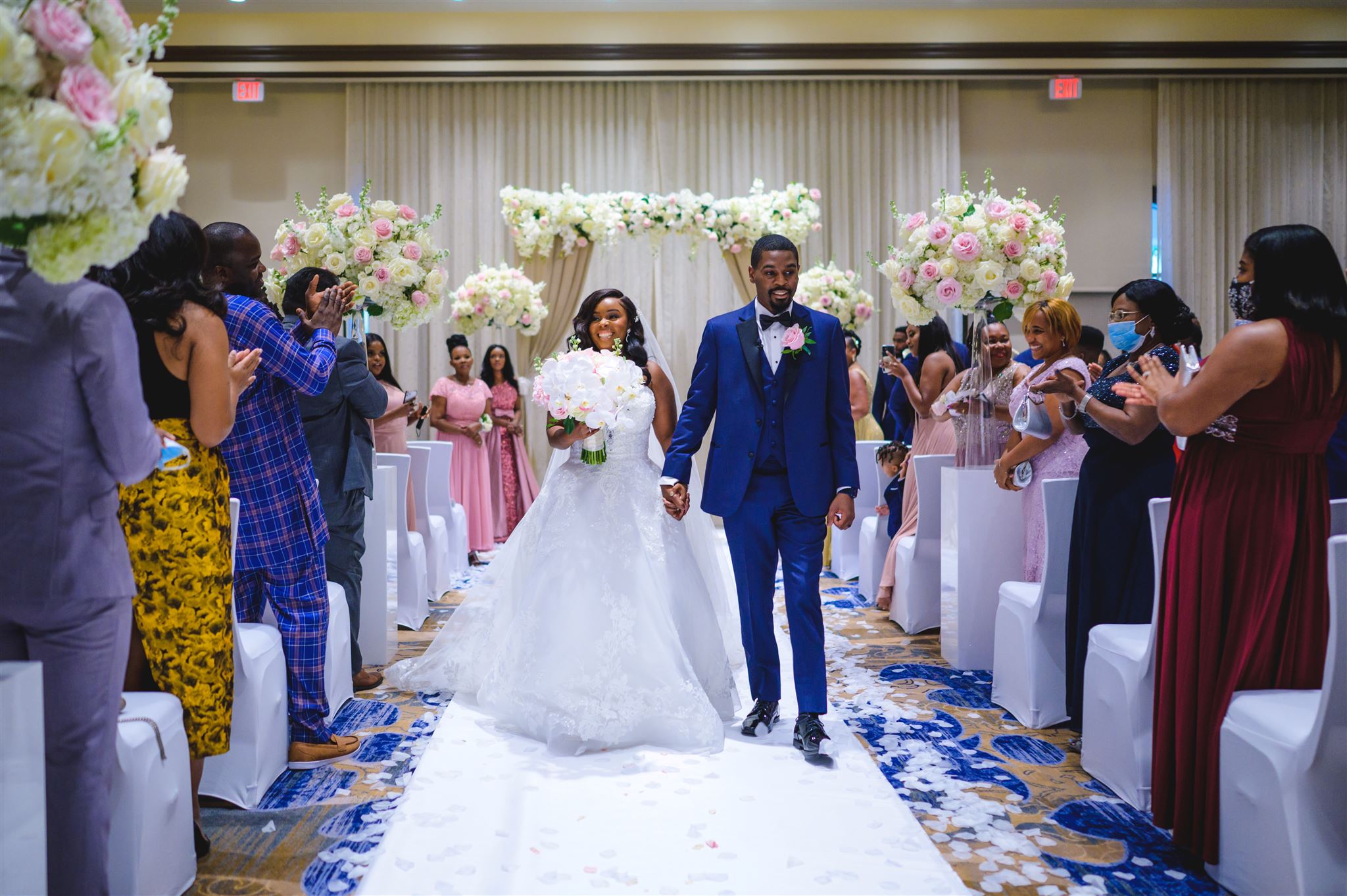 Haitian couple walking down the aisle during the wedding recessional