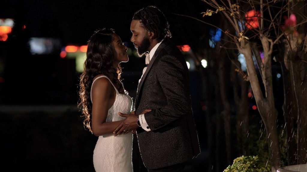 Haitian bride and groom outside at night