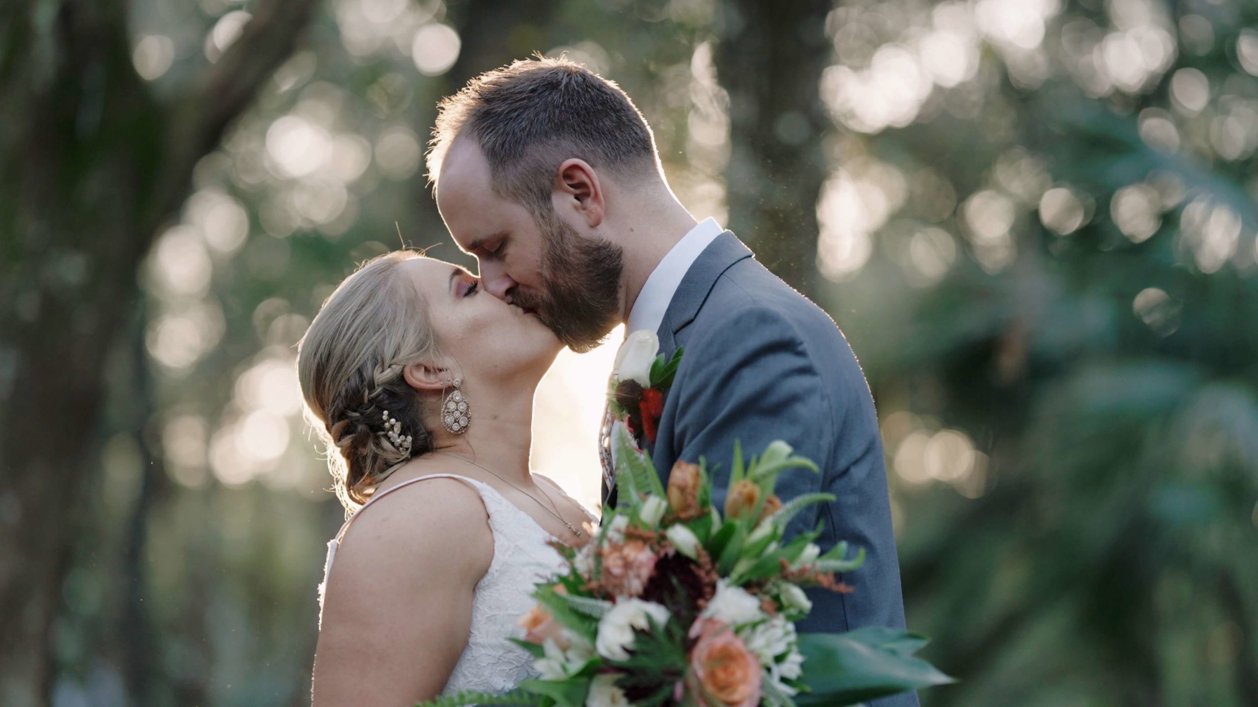 Bride and Groom kissing in the woods at their Deland wedding